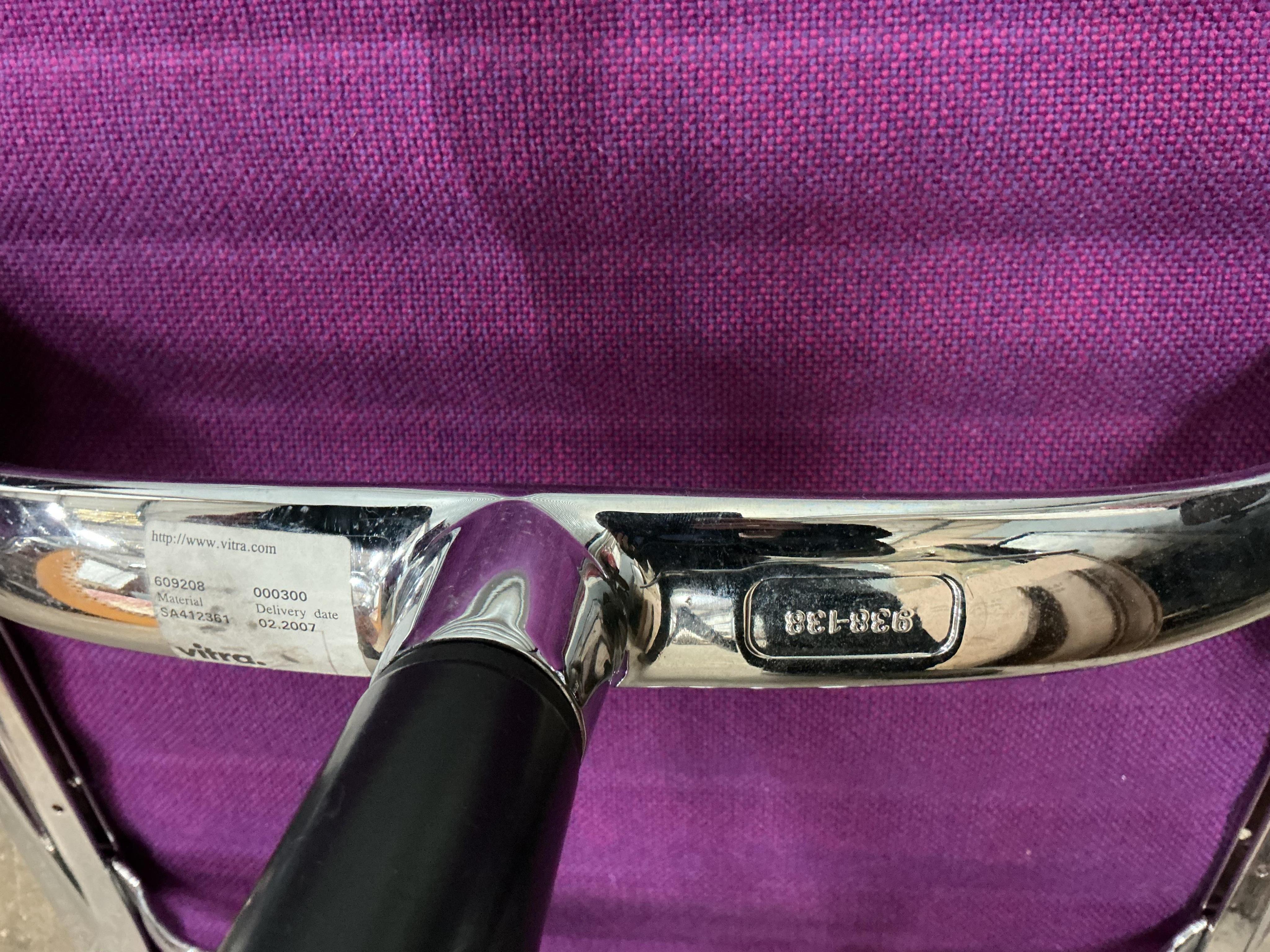 Charles Eames for Vitra, a chrome swivel desk chair on four prong base, width 57cm, depth 50cm, height 82cm